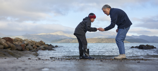 Man and child at shoreline